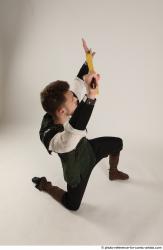 KEETA KNEELING POSE WITH SWORD